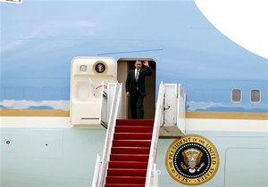 President Barack Obama waves from Air Force One upon arrival from Puerto Rico at Andrews Air Force Base, Md. on Tuesday, June 14, 2011.