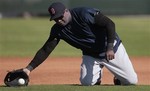 Boston Red Sox designated hitter David Ortiz catches the ball during a drill where infielders work from their knees on the first day of spring training baseball for the full Red Sox squad at the Player Development Complex in Fort Myers, Fla., Saturday, Feb. 19, 2011.