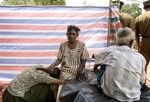 The Internally Displaced Persons wait for the arrival of Secretary-General Ban Ki-moon at the Manik Farm Camp.