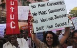 Indian activists hold banners as they participate in a protest against proposed nuclear plant in Mumbai, India, Monday, March 21, 2011. The protest was organized by environmentalists and Leftist trade unions against the proposed Jaitapur nuclear power plant in MaharashtraÕs Konkan region.