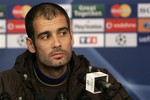 FC Barcelona's coach Josep Guardiola looks on during a press conference in Lyon, central France, Monday, Feb. 23, 2009. FC Barcelona will face Lyon in a Champions League round of 16 match on Tuesday