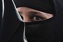 A girl wearing a burqa hides behind another as they visit the Abdullah Shah Ghazi Mausoleum in Karachi April 23, 2009. Hundreds of devotees pay their respects daily at the tomb of Ghazi, a ninth-century Sufi saint.  REUTERS/Athar Hussain   (PAKISTAN RELIGION)