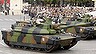 French army Leclerc tanks from the 12th Cuirassier Regiment drive down the Champs-Elysees during the Bastille Day parade in Paris, July 14, 2011. REUTERS/Benoit Tessier (FRANCE - Tags: MILITARY ANNIVERSARY)