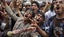 Anti-government protestors shout slogans during a demonstration demanding the resignation of Yemeni President Ali Abdullah Saleh, in Sanaa, Yemen, Thursday, June 2, 2011.