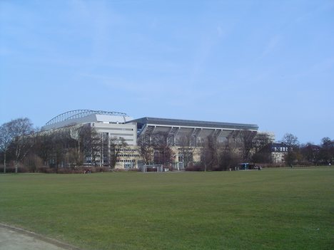 Parken Stadium (English: the Park) is a football stadium in the Indre Østerbro (Inner Østerbro) district of Copenhagen, Denmark, built from 1990-1992. It currently has a capacity of 38,050 for football games, and is the home ground of F.C. Copenhagen and the Danish national football team. The capacity for concerts exceeds the capacity for matches - the stadium can hold as many as 50,000 people with an end-stage setup and 55,000 with a center-stage setup.