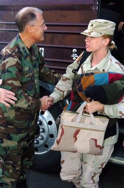 US Army (USA) Major General (MGEN) Thomas Cutler (left), Michigan State Adjutant General, welcomes home a USA Sergeant (SGT) from the 263rd Personnel Services Detachment, Michigan Army National Guard (MIARNG), as she arrives home at Lansing, Michigan (MI)