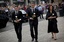 Norway's Prime Minister Jens Stoltenberg, center, his wife Ingrid Schulerud, right, and the leader of the Workers' Youth League (AUF), Eskil Pedersen, left, pay tribute to victims of the twin attacks before a memorial service at Oslo Cathedral, Sunday, July 24, 2011.