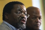 African National Congress, Secretary-general, Gwede Mantashe addresses a press conference in Johannesburg, South Africa, Tuesday, Sept. 23, 2008. South Africa's ruling party says that the finance minister and seven other top Cabinet officials will serve the country's new administration despite resigning earlier in the day. The South African stock market plunged over the news of the mass resignations. Mantashe told a hastily convened news conference: "They are and will continue to do the work they are