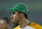 South Africa's captain Graeme Smith reacts as he comes out to meet cricketers from New Zealand who won the Cricket World Cup quarterfinal match between South Africa and New Zealand in Dhaka, Bangladesh, Friday, March 25, 2011.