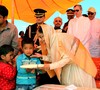 President Pratibha Patil interacts with a kid while meeting with the victims of recent flash floods in Leh on Wednesday.