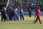 Zimbabwean batsman Hamilton Masakadza, right, walks off the pitch after been dismissed during the match against India at Harare Sports Club in Harare, Zimbabwe, Thursday, June 3, 2010. Zimbabwe is hosting a triangular series match featuring Sri Lanka and India.