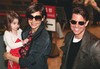 Actor Tom Cruise, right, and actress Katie Holmes with their daughter Suri smile upon their arrival at Narita International Airport in Narita, east of Tokyo, Sunday, March 8, 2009. Cruise arrived here for the premiere of his new film "Valkyrie."