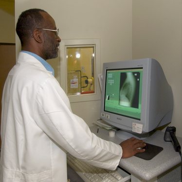 Lead x-ray technologist, James Crisler checks a recent x-ray on the monitor of a Direct Ray digital machine