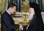 Russian President Dmitry Medvedev, left, greets Ecumenical Patriarch Bartholomew I of Constantinople in the Kremlin in Moscow, Tuesday, May 25, 2010.