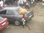 A bread seller carries loaves of Bread along the Campbell Street in Freetown