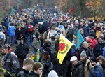 Hundreds of anti nuclear protesters block the tracks near Hitzacker, northern Germany, Sunday, Nov. 7, 2010. Activists rappelled down from a high bridge, broke through police lines and chained themselves to German train tracks Sunday, trying to halt a shipment of nuclear waste as they protested Chancellor Angela Merkel's plans to keep using nuclear energy.