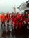 KODIAK, Alaska - A Coast Guard Air Station Kodiak MH-60 Jayhawk helicopter crew and the Tug Aries crew pose next to the 6007 June 26, 2011 at St. Paul Island. The helicopter crew helicopterrescued the four crewmembers of the tug Aries from their barge 109 miles east of St. Paul Island after the 68-foot tug sank in the Bering Sea. U.S. Coast Guard photo. (1298505) ( 110626 G 0000x 500 Airsta Kodiak H60, Tug Aries crew group )