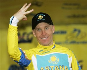 Team Astana's Levi Leipheimer gestures with three fingers to represent his third race win while standing on the podium at the conclusion of Stage 8 of the Tour of California cycling race in Escondido, Calif., Sunday, Feb. 22, 2009.