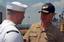 Commander, U.S. Fleet Forces Command (FFC), Adm. Gary Roughead, speaks with a Sailor aboard the Military Sealift Command (MSC) hospital ship USNS Comfort (T-AH 20) during a pre-deployment visit.