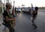 Libyan rebels man a check point position at Bab El Bahrah district in Tripoli, Libya, Tuesday, Aug. 23, 2011.