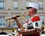 Soldier of the Music of the French Foreign Legion playing the bugle during the celebrations of Bastille Day 2008 in Paris.