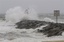 Waves and wind from Hurricane Irene pound the Rudee inlet jetty in Virginia Beach , Va., Saturday, Aug. 27, 2011.