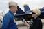 CBS television reporter Celine McArthur interviews Blue Angel's pilot Marine Corps Maj. Nathan Miller, #7 pilot of the Blue Angels, prior to her media ride in a Blue Angels F/A-18 Hornet.