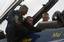 Brian Schneider, catcher for the Washington Nationals baseball team, receives preflight instructions from the crew chief, Marine Corps Staff Sgt. Deo Harrypersaud, before taking a ride in a Blue Angels F/A-18 Hornet.