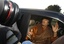 Libyan leader Moammar Gadhafi sits in a car in Tripoli, Libya, Sunday, April 10, 2011.