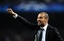 FC Barcelona's coach Josep Guardiola reacts during their Group F Champions League first leg soccer match against Rubin Kazan at the Camp Nou stadium in Barcelona, Spain, Tuesday, Oct. 20, 2009