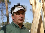 Actor Alec Baldwin, works at Habitat for Humanity Wednesday, Nov. 9, 2005, in Covington, La.