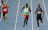 Grenada's Kirani James, center, crosses the finish line ahead of USA's LaShawn Merritt, right, and Belgium's Kevin Borlee in the Men's 400m final at the World Athletics Championships in Daegu, South Korea, Tuesday, Aug. 30, 2011.