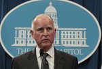 Gov. Jerry Brown listens to a reporters questions while discussing his plans to deal with an estimated $25.4 billion state budget deficit during a news conference where he released his $84.6 billion general fund state spending plan at the Capitol in Sacramento, Calif., Monday, Jan. 10, 2011.