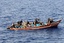 A VBSS team from the guided-missile cruiser USS San Jacinto (CG 56) search a skiff suspected of participating in recent pirate activity.