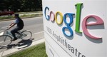 Google worker rides a bike at the company's headquarters in Mountain View, Calif. From Caterpillar to Chevron to Google, some of the best-known names in corporate America are scooping up smaller companies, finally putting the piles of cash they've been sitting on to use and positioning themselves for an economic recovery.