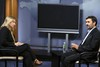 File - Mahmoud Ahmadinejad (right), President of the Islamic Republic of Iran, sits for an interview with Paula Harrington, Executive Producer of UNifeed, inside UNTV Studio H, at UN Headquarters.