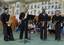 From left, Musician 2nd Class Jose Acosta, Musician 3rd Class Phil Martin, Musician 2nd Class Lloyd Whitty and Musician 2nd Class Richard Devoe perform The Entertainer to students at Lester Middle School, Camp Lester.