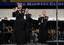 Master Chief Musician Betty R. Myers, left, Musician 1st Class Jennifer D. Smith, center and Chief Musician Luellyn K. Dollard play the piccolo with the Navy Band during The Stars and Stripes Forever at the 61st annual Midwest Clinic.