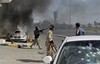 Libyan rebel fighters seen during fighting in downtown Tripoli, LIbya, Monday, Aug. 22, 2011.