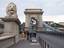 The lions guarding the entrance. Among the mythical anecdotes relating to the bridge, the most popular is that the lions were sculpted without tongues and the sculptor was mocked so much that he jumped into the Danube in shame.