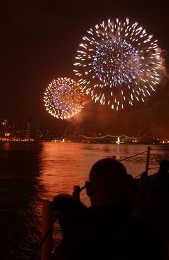 NEW YORK, New York (July 4)--Petty Officer 3rd Class Albert L. Lowery, from the Coast Guard Cutter ADAK out of Sandy Hook, NJ, watches the Macy's 4th of July fireworks display on the East River, NY, July 04, 2002 . Dozens of Coast Guard patrol and rescue boats provided security for the July 4th celebration. USCG photo by PA2 Tom Sperduto (83270) ( JULY 4TH PATROL (FOR RELEASE) )