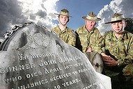 Gunner Dale Rettke, Warrant Officer Class Two Keith McCoombes and Captain Andrew Kendall at the grave of gunner John J. Hayes at Ipswich Cemetery.