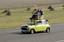 Rowan Atkinson on a Mini at Goodwood Circuit in 2009