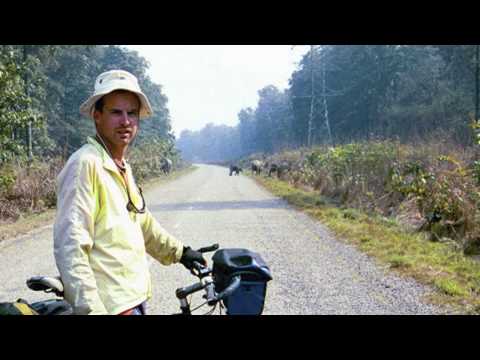 Around the world on a bicycle -- One man's quest for happiness [Short version]