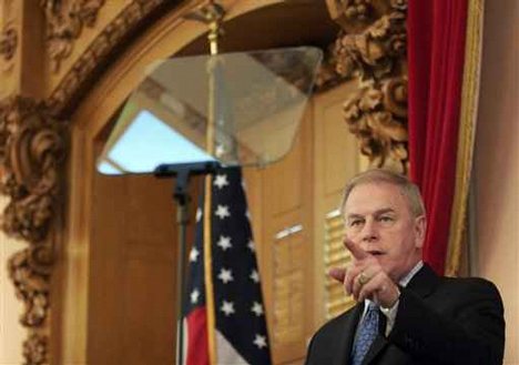 Ohio Gov. Ted Strickland checks the teleprompter as he walks through the house chamber Tuesday, Jan. 27, 2009 in Columbus, Ohio.