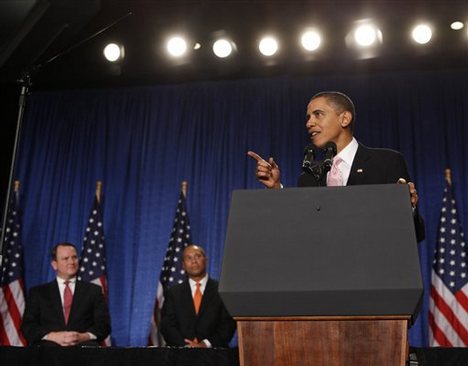 President Barack Obama speaks at a fundraiser for Massachusetts Gov. Deval Patrick, center, Friday, Oct. 23, 2009, in Cambridge, Mass. At left is Massachusetts Lt. Gov. Tim Murray.