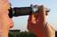 Winemakers use a refractometer on samples of grapes picked in the vineyard to measure sugar levels while determining ripeness.