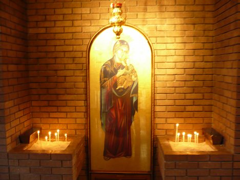 A prayer corner in an Orthodox temple, utilized by parishioners during services for veneration and specific petitions.