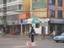 A policeman directs traffic in a Linxia street. Linxia City is the main transportation center of Linxia Hui Autonomous Prefecture.