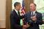 President Barack Obama talks with Garth Brooks, who was presented with the 